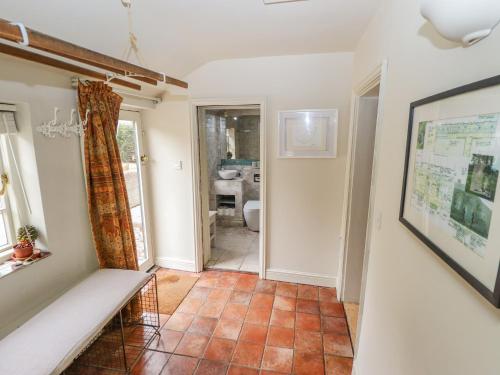 a living room with a tiled floor at Jolls Cottage in Horncastle