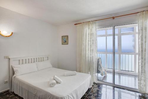 Postel nebo postele na pokoji v ubytování Estudio mesa del mar
