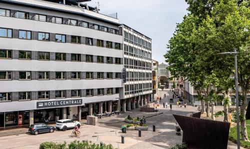 a large white building on a city street at Hotel Centrale in Mestre