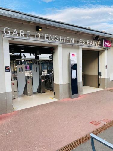 a gas station with machines in front of it at Studio Exotique Hyper-Centre Enghien 12min Paris in Enghien-les-Bains