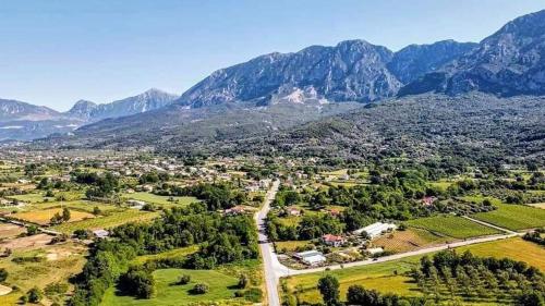 an aerial view of a town with mountains in the background at Erietta Rooms in Paramythia