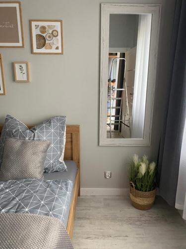 Ένα ή περισσότερα κρεβάτια σε δωμάτιο στο Apartament MOMENT