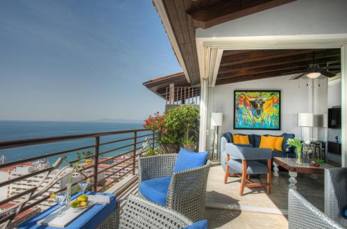 a balcony with a view of the ocean at Pinnacle Resorts 180 in Puerto Vallarta