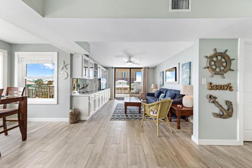 a living room with a couch and a table at Compass Point 310 in Gulf Shores