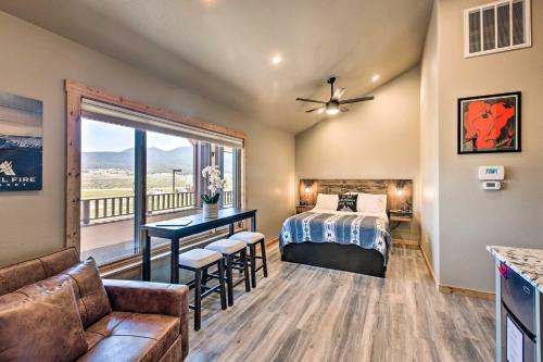 a bedroom with a bed and a balcony at Dreamy Angel Fire Studio Less Than 2 Mi to Ski Resort! in Angel Fire