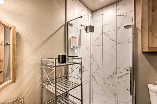 a bathroom with a shower with a glass door at Dreamy Angel Fire Studio Less Than 2 Mi to Ski Resort! in Angel Fire