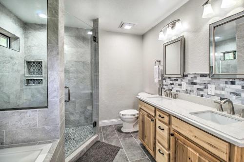 a bathroom with a shower and a sink and a toilet at Game Room and Wooded Views Pinetop Cabin! in Pinetop-Lakeside