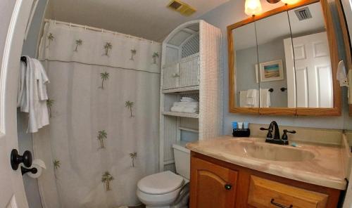 a bathroom with a shower and a sink and a toilet at Sea Club Condo #1 in Clearwater Beach