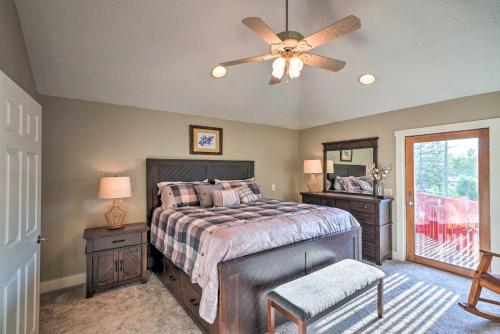 a bedroom with a bed and a ceiling fan at Waterfront Mound Retreat with Boat Dock Access! in Mound