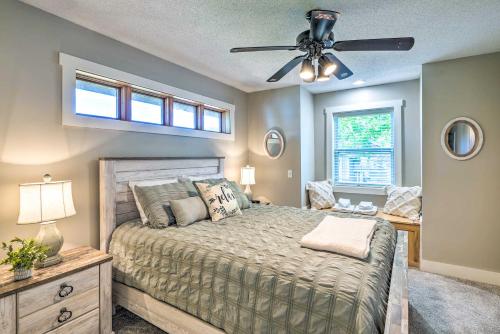 a bedroom with a bed and a ceiling fan at Waterfront Mound Retreat with Dock and Lake Access! in Mound