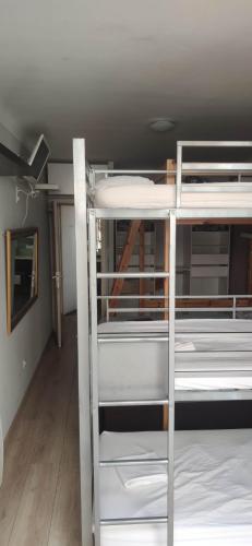 a group of bunk beds in a room at logement chambre seul en supplément ou dortoir mixte in Roquemaure