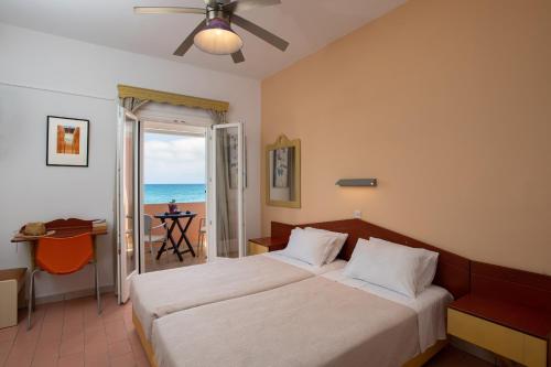 Ένα ή περισσότερα κρεβάτια σε δωμάτιο στο Vlachos Apartments Acharavi