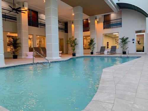 a swimming pool in the middle of a building at TRYP by Wyndham Mayaguez in Mayaguez