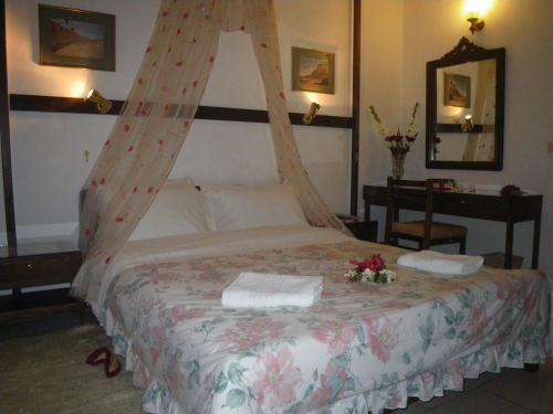 A bed or beds in a room at Villa Georgie