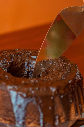 a knife sitting on top of a chocolate cake at Hotel Preá in Prea