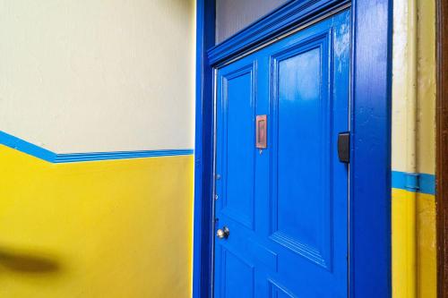 two blue doors are next to each other at The Palais in Dundee