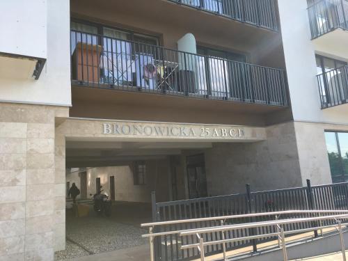 a building with a balcony with a dog on a balcony at Scandinavian in Szczecin