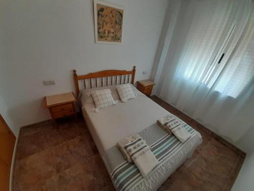 Posteľ alebo postele v izbe v ubytovaní Apartment near La Mata beach