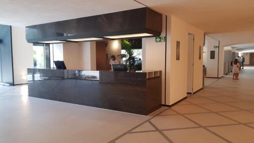 a lobby with a reception desk in a building at New & Beautiful Loft in Puerto Banus in Marbella