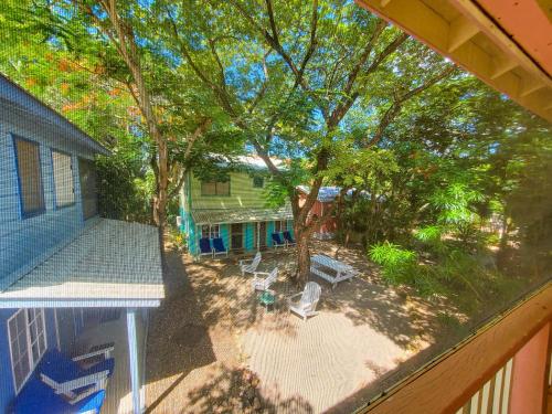 an overhead view of a backyard with a tree and a house at Placencia Villas in Placencia Village