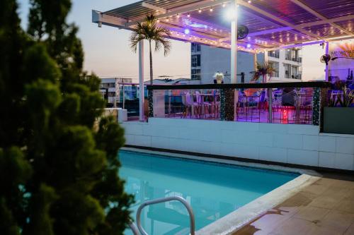 a swimming pool on the roof of a building at Hotel Barrancabermeja Plaza in Barrancabermeja