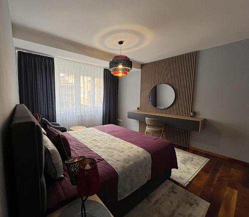 Ένα ή περισσότερα κρεβάτια σε δωμάτιο στο Astoria M&S