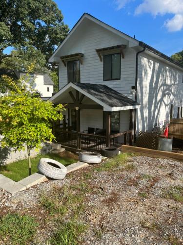 a house with two tires in the front yard at Atlanta Unit 2 Room 1 - Quiet Private Bedroom Private Bathroom in Atlanta