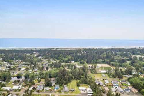 an aerial view of a town with houses and trees at The Mariner in Westport