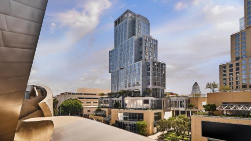 a rendering of a tall building in a city at Conrad Los Angeles in Los Angeles