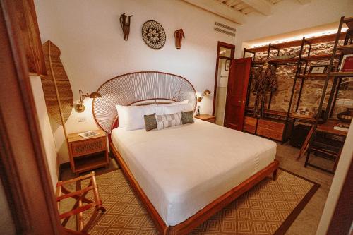 Ein Bett oder Betten in einem Zimmer der Unterkunft Amarla Boutique Hotel Casco Viejo