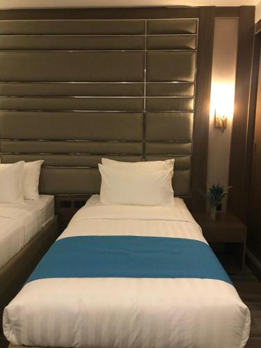 Кровать или кровати в номере El Vistra Hotel Angeles