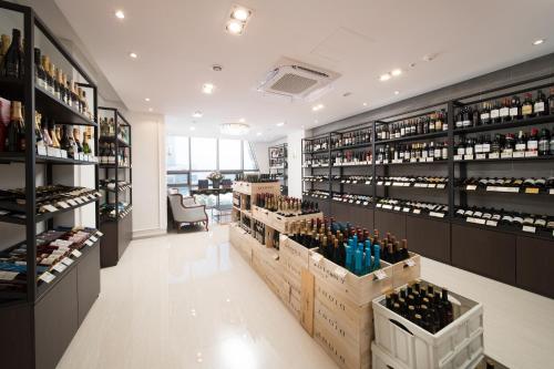 a wine store with lots of bottles of wine at Utop Marina Hotel & Resort in Yeosu