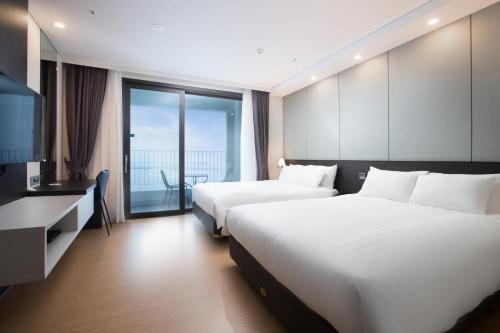 Кровать или кровати в номере Utop Marina Hotel & Resort