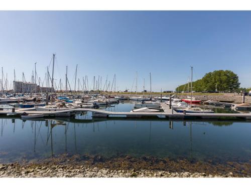 a bunch of boats docked in a marina at Apartment in Sint-Annaland with Water Views in Sint Annaland