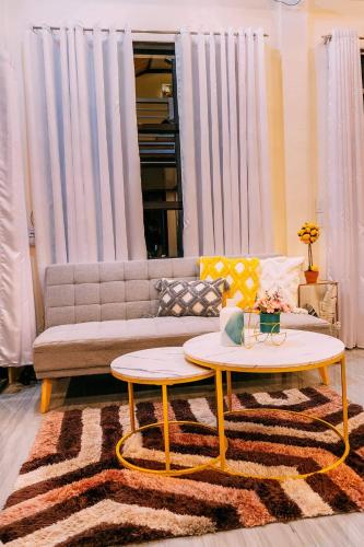 a living room with a couch and a coffee table at Palompon kalimba de luna Villa Inn in Leyte