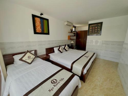 Katil atau katil-katil dalam bilik di Ngo House Villa