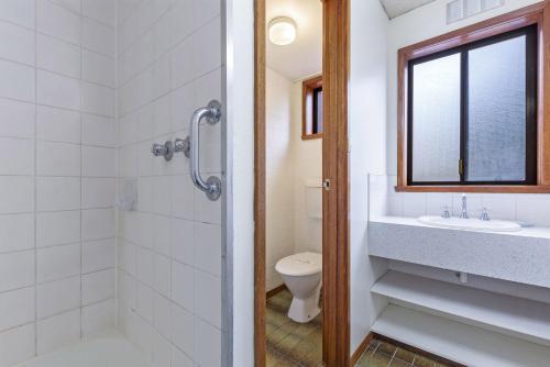 a bathroom with a toilet and a sink at Eastern Beach Unit 1 in Port Fairy