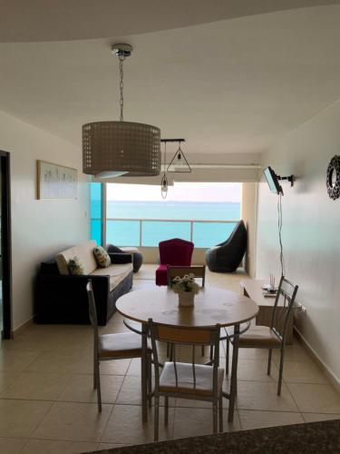 Posezení v ubytování Departamento en Torre Oceanica