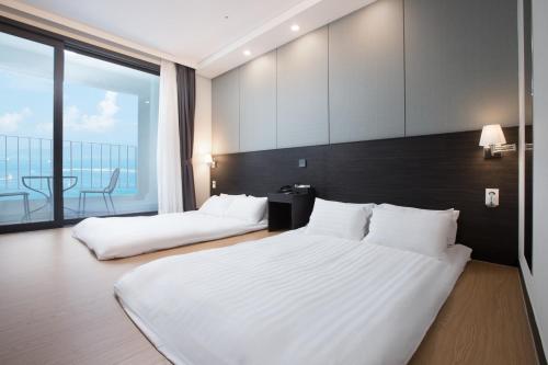 Кровать или кровати в номере Utop Marina Hotel & Resort