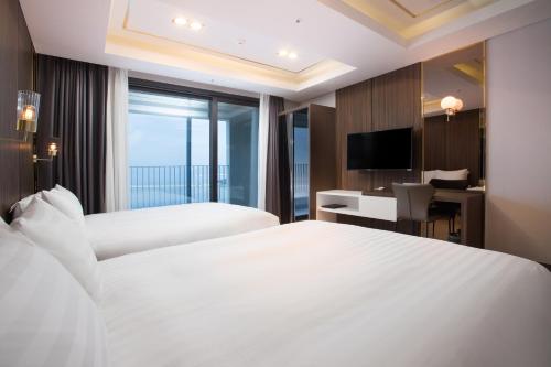 Кровать или кровати в номере Utop Marina Hotel & Resort