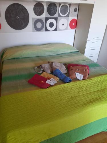 two stuffed teddy bears laying on a bed at Terrazza su volta storica in Montesano Salentino