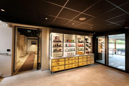 a store with a display case with bottles of wine at Chateau De Germigney in Port-Lesney