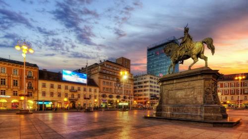 a statue of a man on a horse in a city at MIA in Zagreb