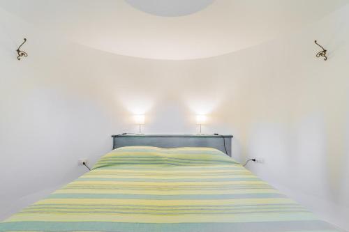 A bed or beds in a room at La Pajara de la Urpe