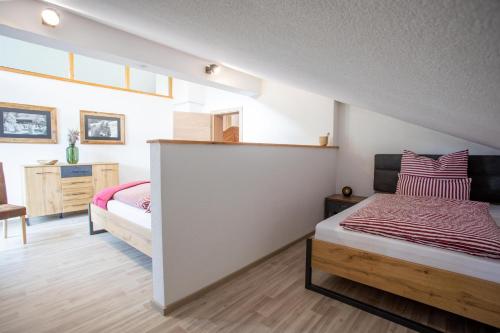 a bedroom with two beds in a room at Ferienwohnung Hoamat in Reutte