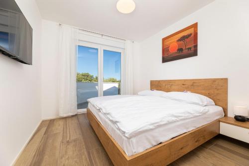 Postel nebo postele na pokoji v ubytování Villa Dani