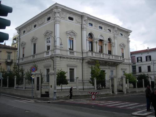 a large white building on the corner of a street at B&B Lanciano in Lanciano