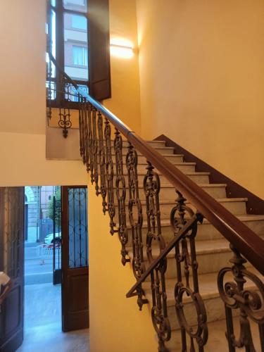 a winding staircase in a house with a door at B&B Lanciano in Lanciano
