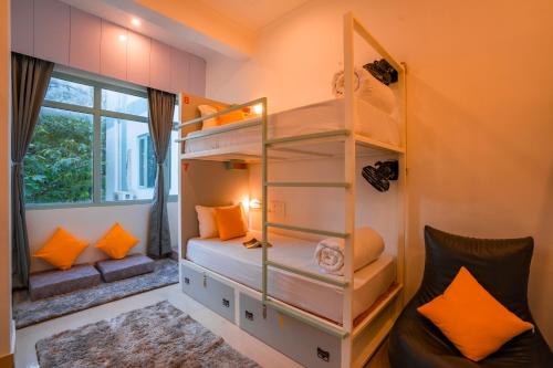 a room with two bunk beds and a window at Zostel Rishikesh, Laxman Jhula in Rishīkesh
