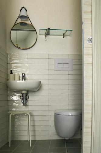 a bathroom with a sink and a toilet at Terrazza Grecale in Rodi Garganico